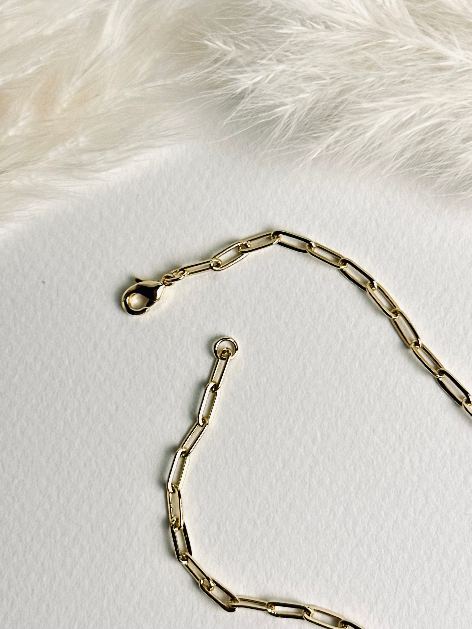 Close-up of the clasp on the personalized clay initial necklace from the “Your Story with Grace” collection, showing the secure 18k gold-filled closure. Highlights thoughtful craftsmanship and elegant, durable design.